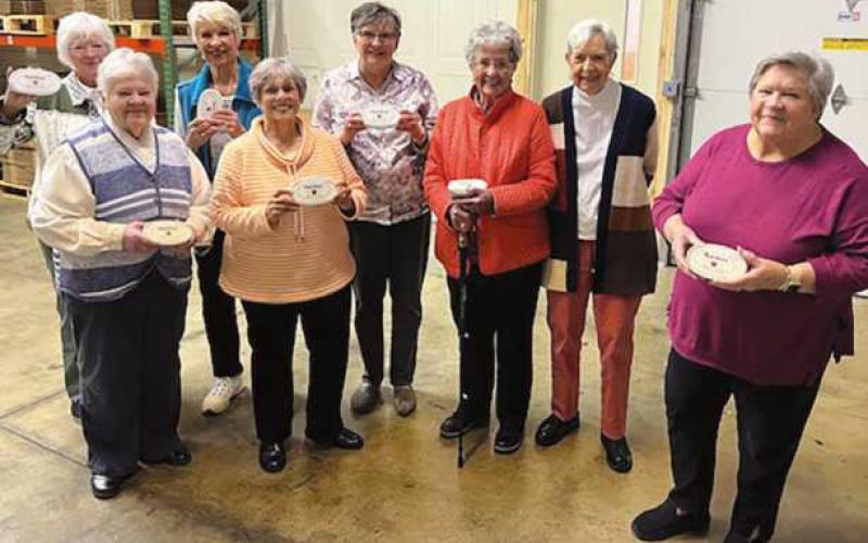 New Century Club members with their complimentary containers of Marsha’s Buckeyes.