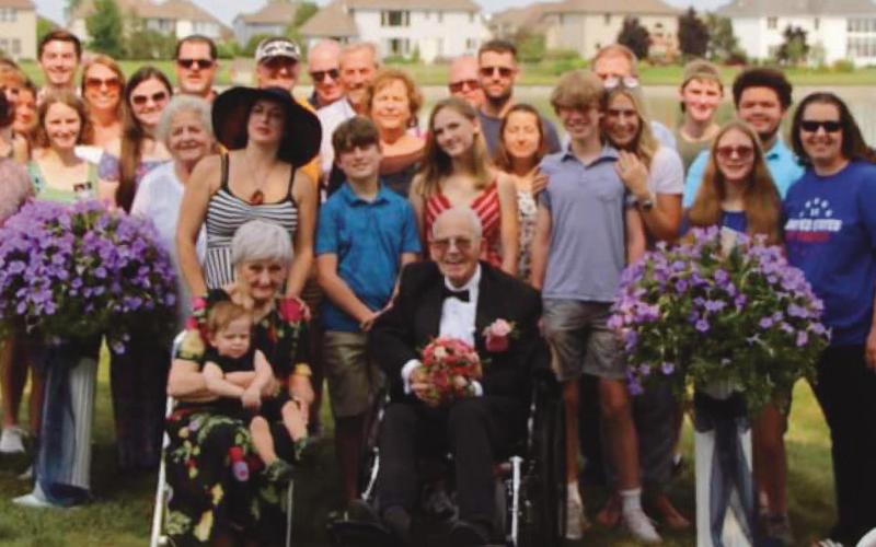 Dorothy and Al Stanton, front, with their family, which includes three daughters, nine grandchildren and 14 great-grandchildren. A son and a daughter died five years ago and a few months ago, respectively. “It took a village to put our anniversary wedding together,” Mrs. Stanton said. “We are very fortunate.”