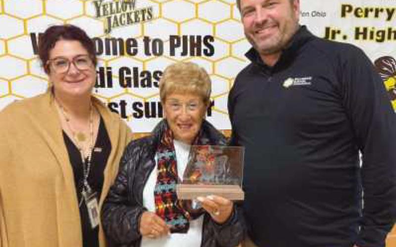 Rodi Glass (middle) with PJHS 8th ELA Teacher Megan Helman (left) and Jeff Abke from Perrysburg Schools Foundation (right).