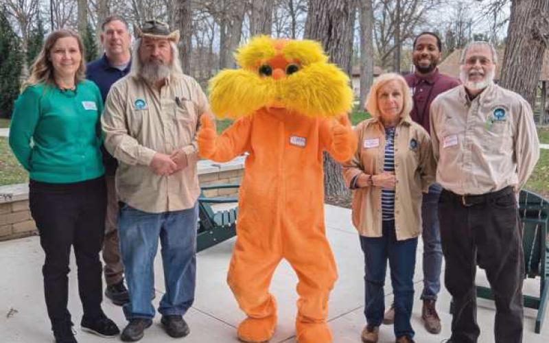From left, back row: City Urban Forester Dan Ledyard and City Planning and Zoning Deputy Administrator Mark Easterling. Front row: Street Tree Commission members Kali Sawaya and Scott Kirby, the Lorax and Street Tree Commission members Christine Ardley and Jim Hagen.