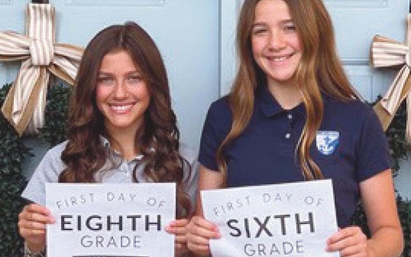 At left, eighth grader Kopelyn Kessler and sixth grader Kieradyn Kessler prepare to return to St. Rose.