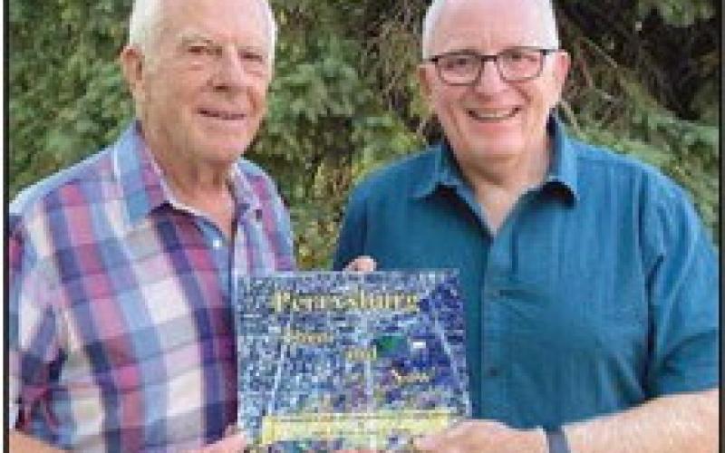 Gary Franks and Mark Weber with their book.