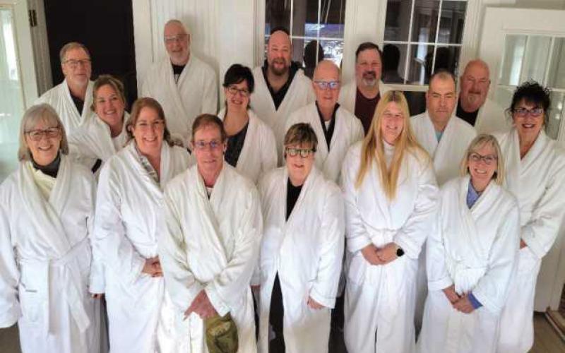 Pictured at right: A tradition at the Carriage House is to take a group photo of guests wearing the robes provided by the bed and breakfast. Pictured are, front row, from left: Phyllis Zibbel, Michelle Abel, Robin Abel, Amy Gross, Loriann Czerniejewski and Darcy Ulrich. Middle row: Vickie Pawlowski, Lucia Rooks, Howie Zibbel, Frank Czerniejewski and Jan Leutz. Back row: Jeff Ulrich, Don Leutz, Dave Pawlowski, Keith Rooks and Clark Gross.