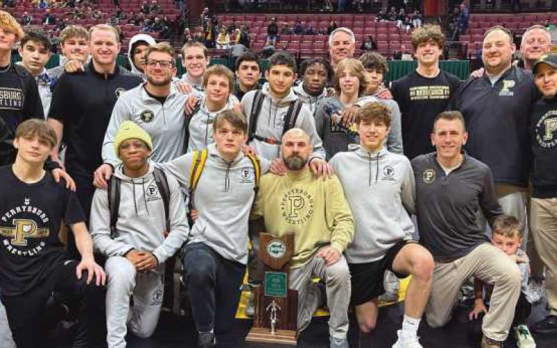 Wrestling team with coach and staff