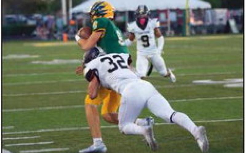 Middle linebacker Joseph Seney tackles Clay quarterback Mason Heintschel.