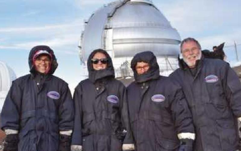 Judy Hagen, second from right, with her husband James and daughters Ali and Liz, submitted this Journal Reader photograph at Mauna Kea observatory during a family trip to Hawaii a number of years ago. At the observatory, they enjoyed stargazing and viewed the glow of the lava from the active volcano on the Big Island.