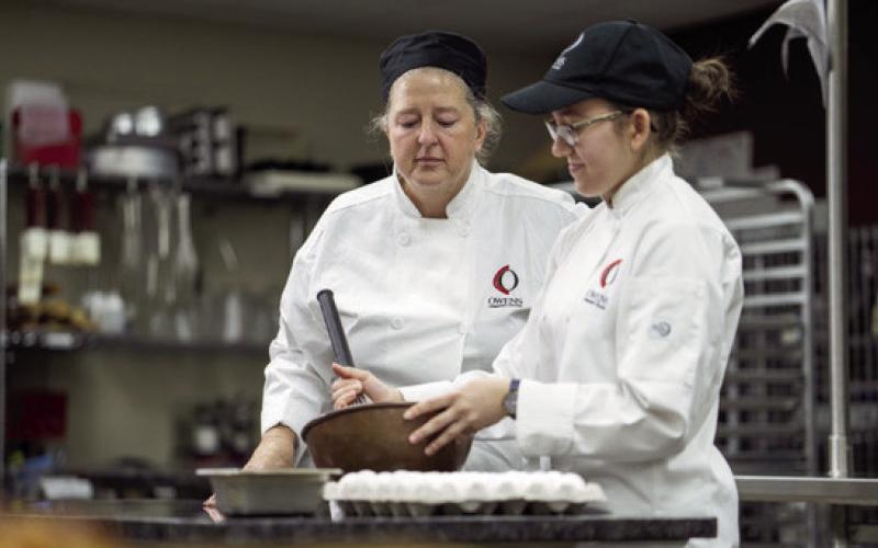 Owens assistant professor Amy Morford works with student Sabrina Myers.