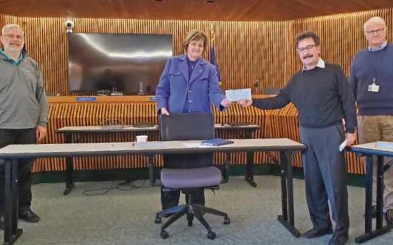 Commissioners present check for Big Fix county pet neutering program