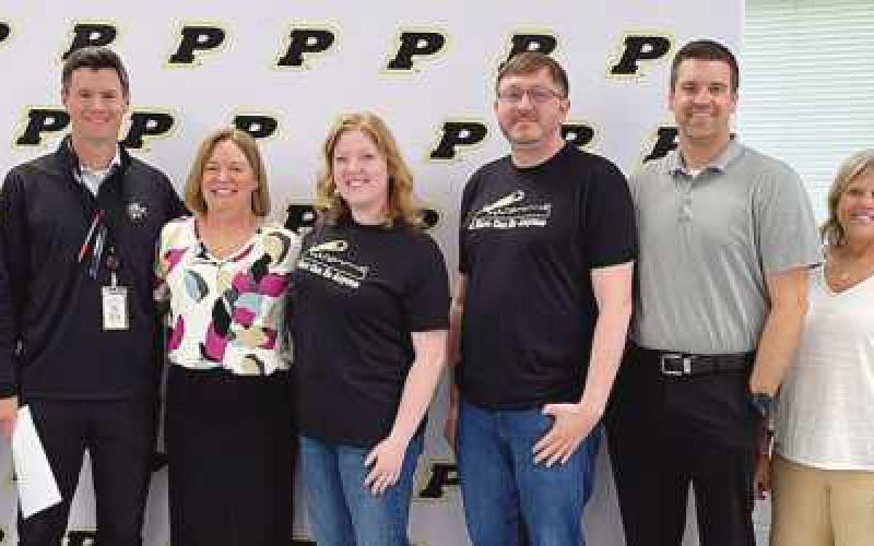 From left: Board Vice President Eric Benington, PJHS Principal Scott Buker, award recipient Andrea Monheim and nominators Stacey Bunker, Corbin Brangham, Brandon Decker, Anne Matolyak and Amanda Fintel.