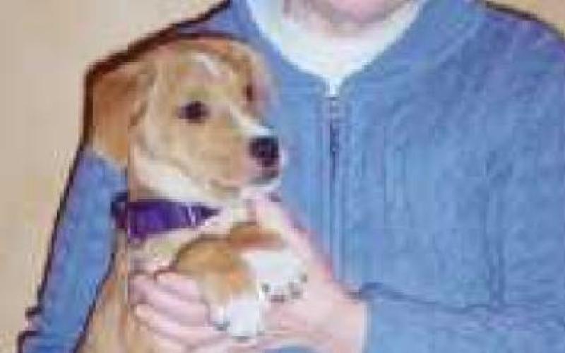 Laurie Hostetler with her daughter’s dog in 2010.