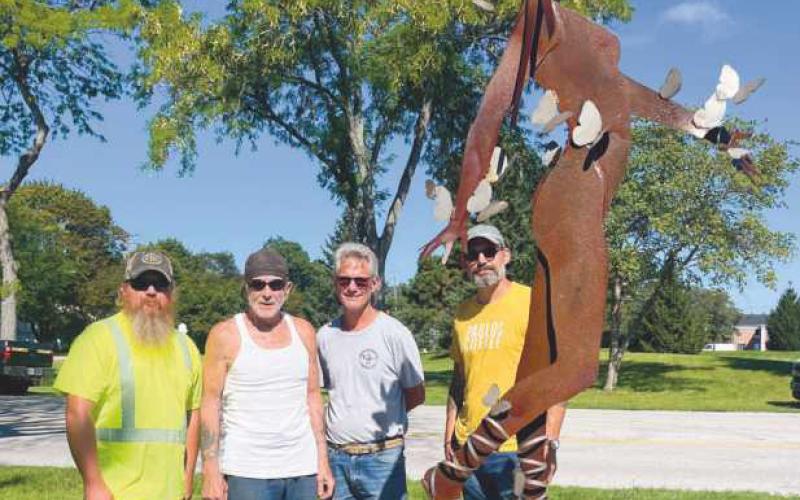 Installation team members preparing the new exhibit include, from left: Jeremy Hurst, operator; Mike Sohikian, installation director; Jim Taylor, installer and Richard Maurer, installer. The team is standing by Mike Sohikian’s sculpture, Nymph of Artemis.