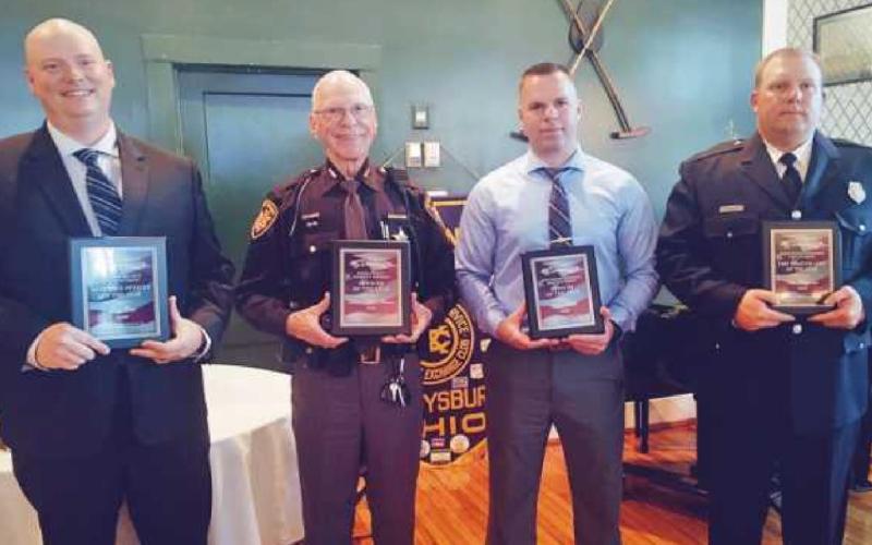 From left are PHS school resource officer Greg Cole, Wood County Sheriff’s Auxiliary Deputy Hobart Johnson, township police officer Ryan Welch and township firefighter Wesley Waggoner. Another recipient, Perrysburg Fire Division firefighter Justin Lynch, was not present for the ceremony.