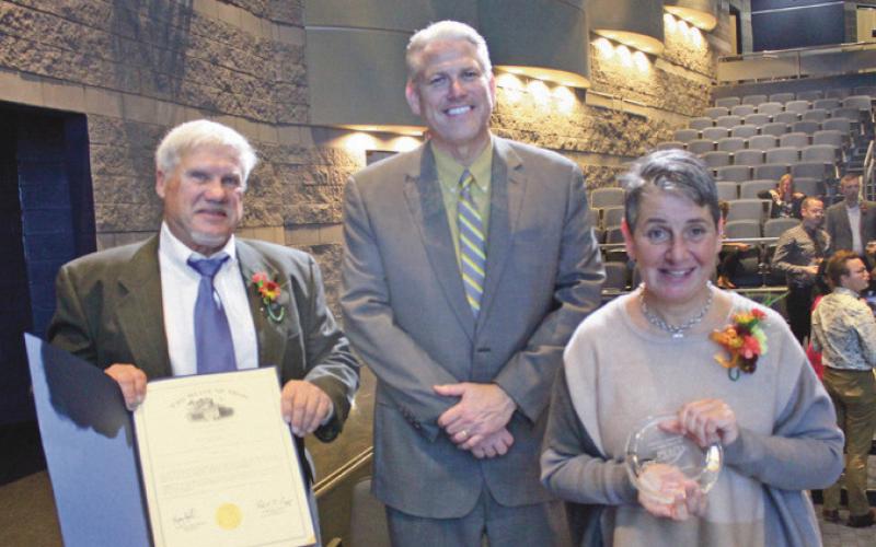 Flanking Perrysburg Superintendent Tom Hosler, center, are the Penta 2022 Outstanding Alumni and PHS graduates James Henry and Christy Armstrong.