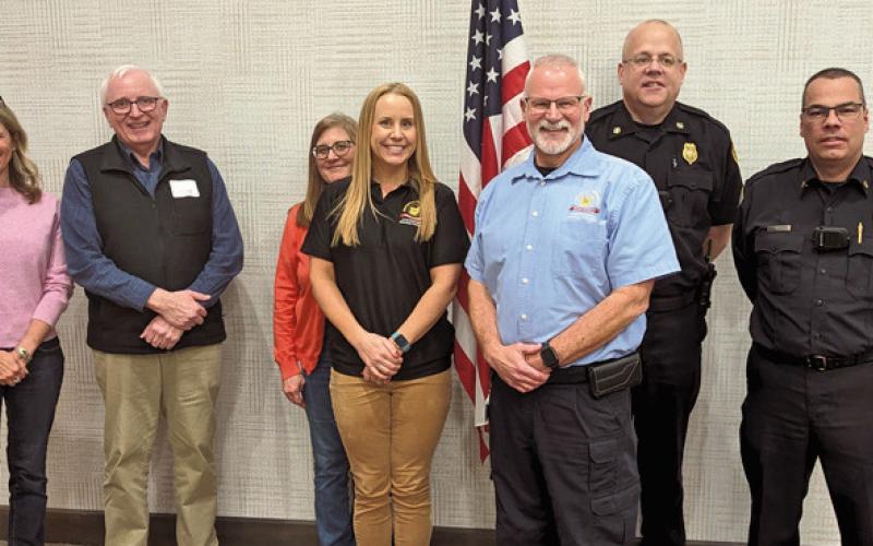Wood County EMA Director Jeff Klein, forefront, is joined by Perrysburg Township fire, chamber and Perrysburg city council members. At the February luncheon, Mr. Klein spoke about the county’s plans to handle the expected influx of people for the April 8 eclipse.