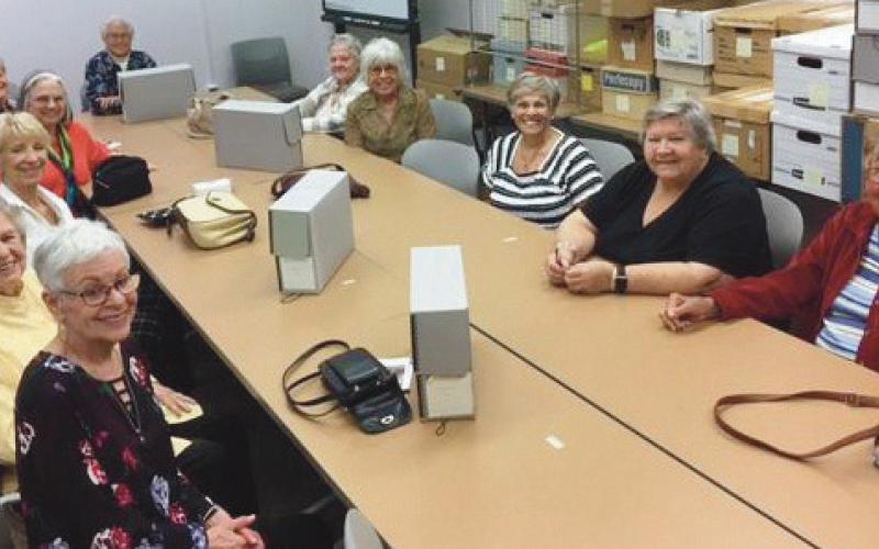 New Century Club members during their visit to the Center for Archival Collections at Bowling Green State University are clockwise from front left: Ricki Rudey, Helen Haas, Sue Stevenson, Wava Hawker, Dee Kroger, Kathy Helmick, Kathy Jarosz, Joanne West, Darlene Limmer, Pat Jacobsen and Doris Currie.