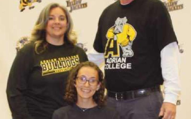 Ciara Heslet will run track for Adrian College where she plans to study interior design. Pictured with her are her parents Todd and Brenda.