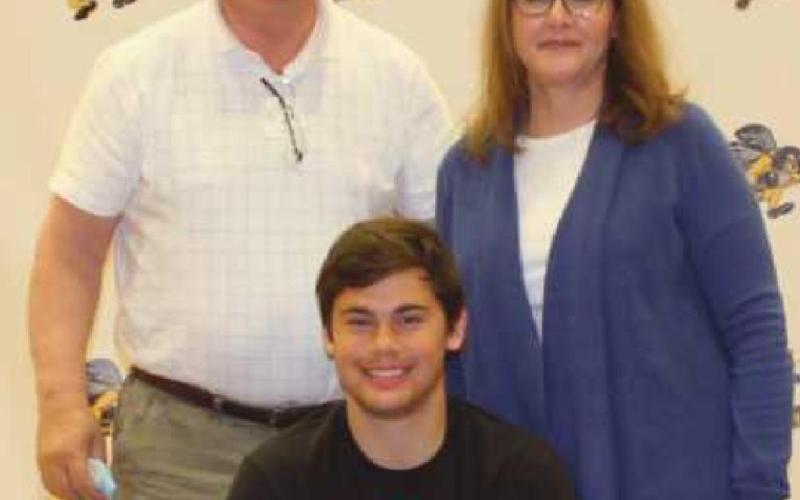 Dylan Ball will run track for University of Findlay where he plans to major in physical therapy studies. He is pictured with his parents Edward and Debra.