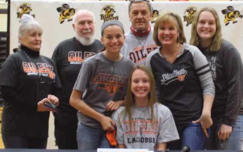 Olivia Alvarado will play lacrosse for University of Findlay, where she plans to major in exercise science. Pictured with her are her grandparents Dennis and Marguerite, sister Lexi, Olivia, parents Luis and Marguerite and cousin Hope Neal.