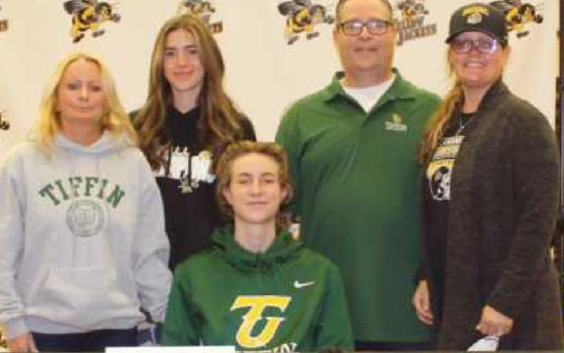 Jaxson Hudson will play football for Tiffin University where he plans to major in sports management. With him are his mother Michelle, father Jeff, stepmother Danielle and friend Mikaela Fish.