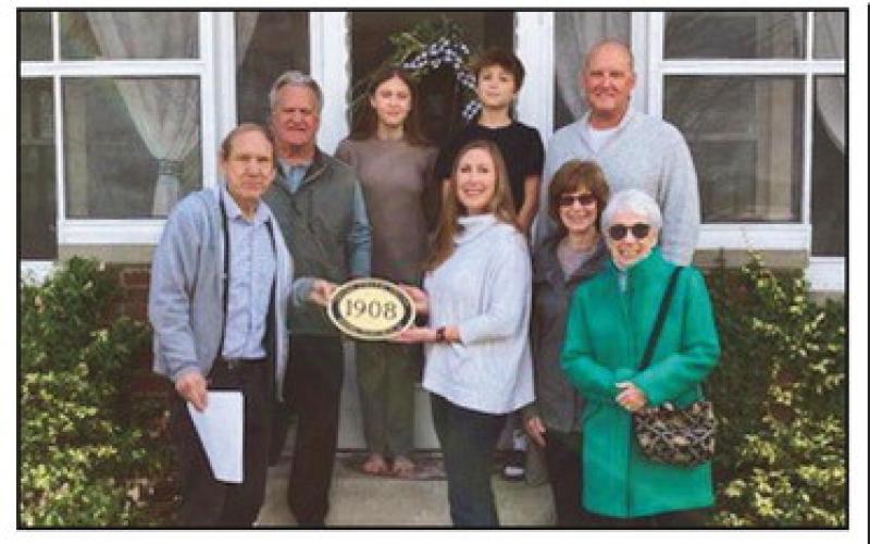 Historic house honored with plaque