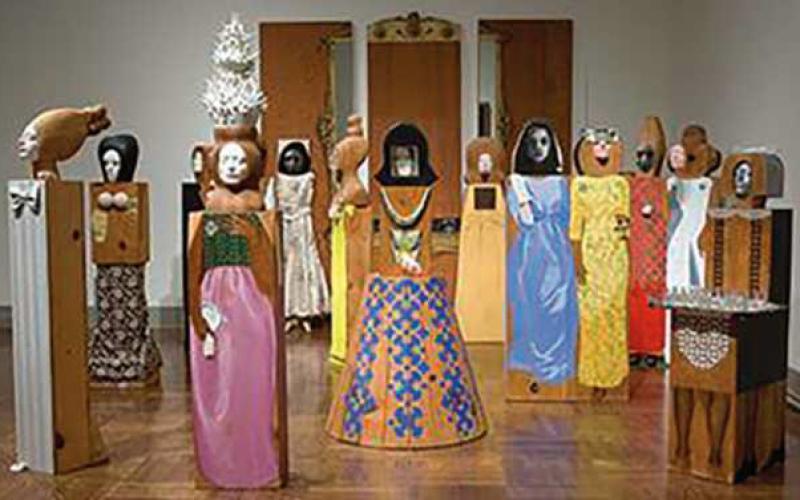 Marisol, “The Party,” assemblage of 15 freestanding, life-size figures and three wall panels, with painted wood and carved wood, mirrors, plastic, television set, clothes, shoes, glasses and other accessories.