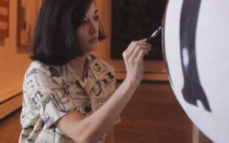 Marisol retouching “The Generals,” at the Albright-Knox Art Gallery in November, 1963.