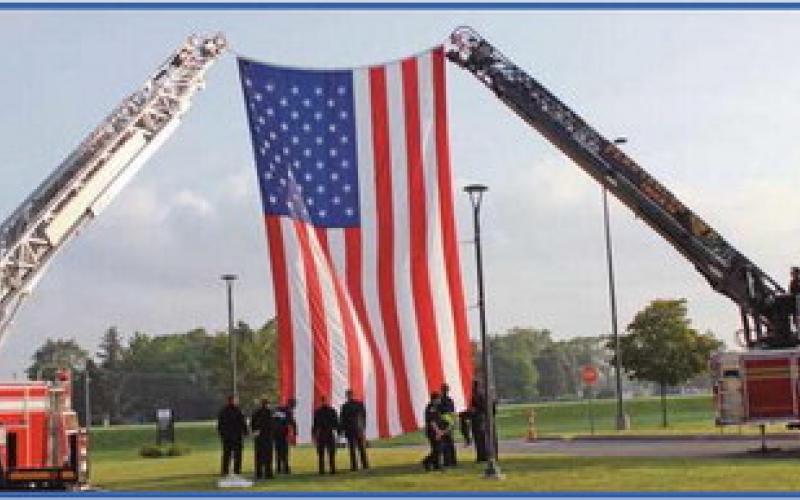 Perrysburg Township and Pemberville fire departments raise the American flag with assistance from Penta’s criminal justice students.