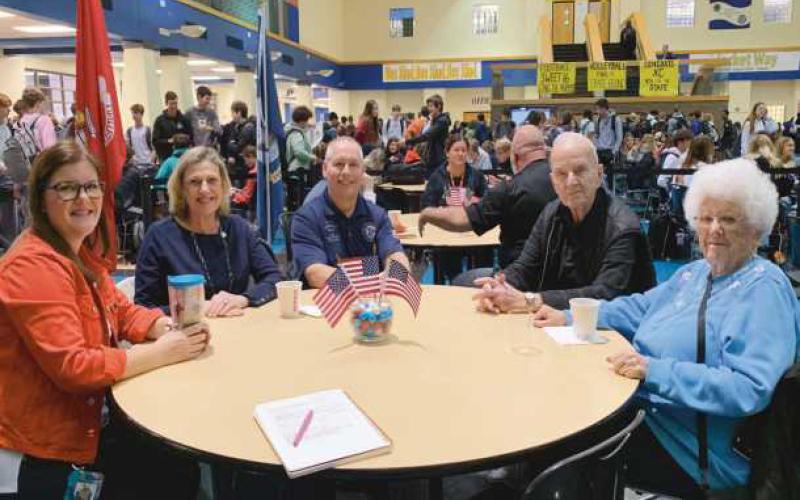 At the breakfast are, from left, Jennifer Beale, Mrs. Smith, Phil Smith, Dale Johnson, and Jeanne Johnson.