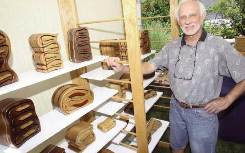 Dave Grabarczyk in his studio with some pieces he made to use as models for photos that appear in his book on making bandsaw boxes.