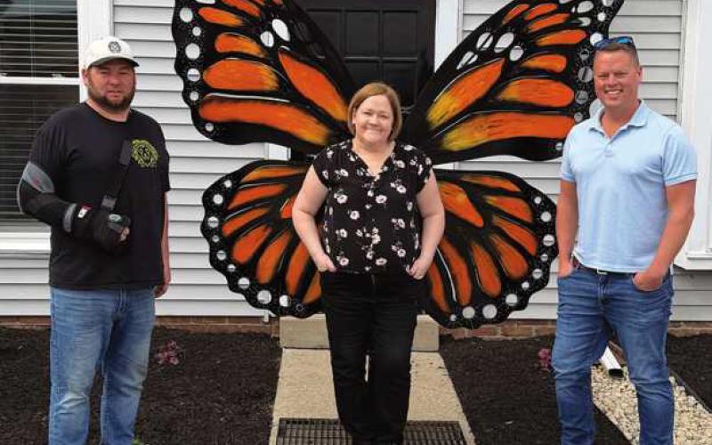 Sculptor Jeff Drushal with Monarch Grief Center co-founders Amy Rowe and Tim Polakowski.