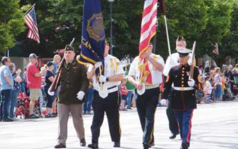 Veterans led the parade, carrying the U.S. and American Legion flags.