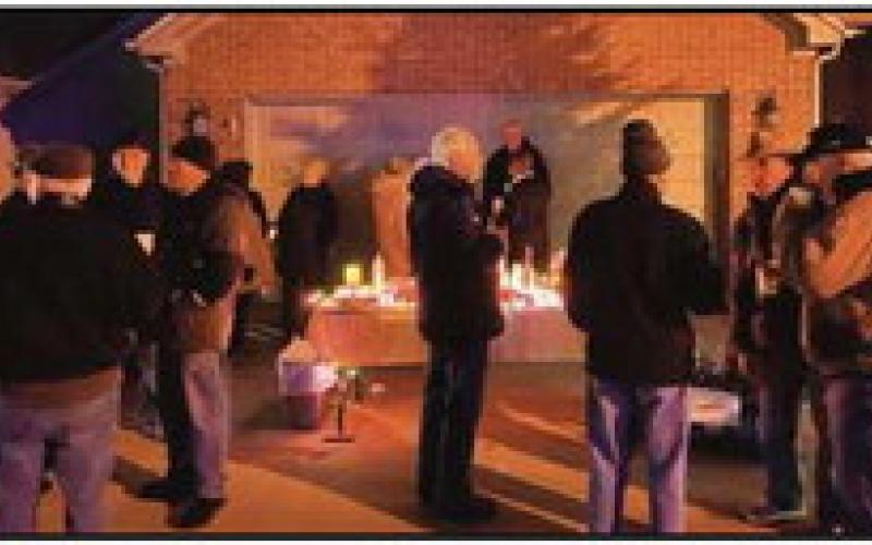 Neighbors gather for tree lighting, assist local charity