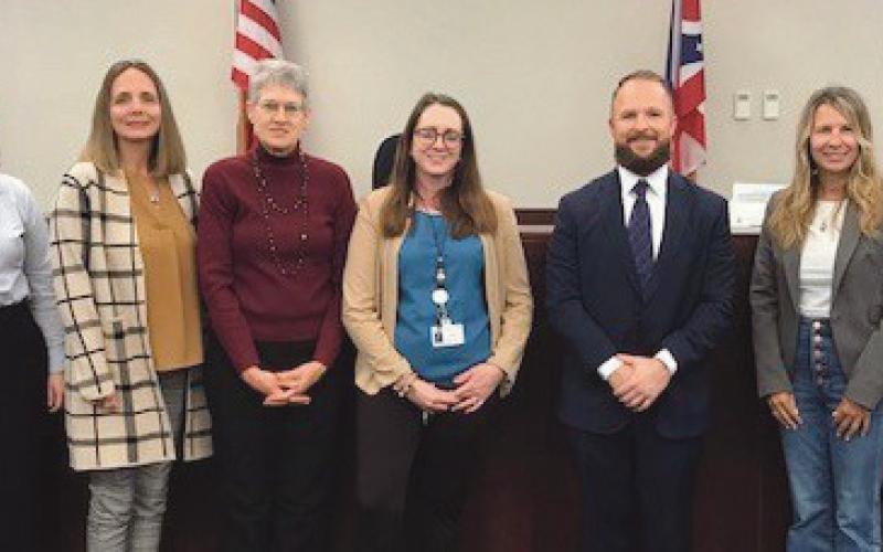 Pictured from left, are: Kristen Leverton, Court Appointed Special Advocates program director, with new CASA volunteers Natalie Reichert of Bowling Green, Shanna Gerken of Bowling Green, Patricia Smith of Perrysburg, Kristina Eynon of Bowling Green, Ryan Wright of Perrysburg, Lisa Riddle of Perrysburg, and Judge Dave Woessner.