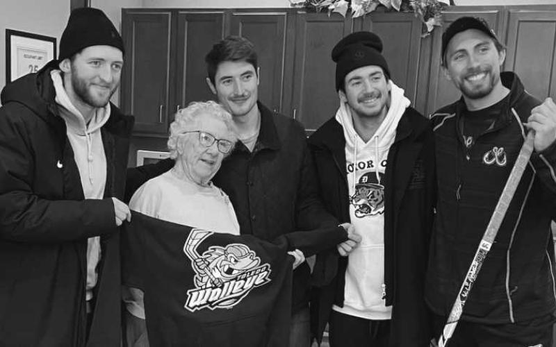 Pictured at the Tree of Dreams program presentation are, from left: Toledo Walleye player Chase Gresock, Waterford resident Ginny Storey, and Walleye players Will Cullen, Brandon Cruse and Sam Craggs.
