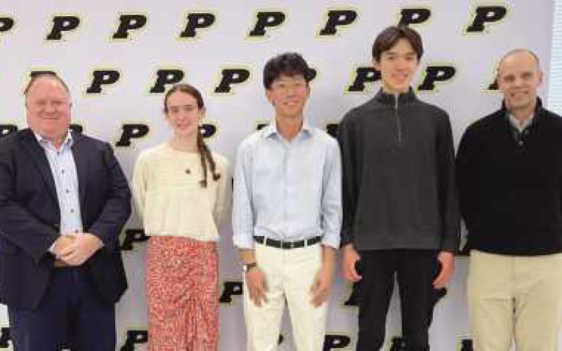 Left to right: Board of Education Vice President Eric Benington, salutatorian Laura Valette, valedictorian and national merit finalist Patrick Chen, national merit finalist Anthony Clark and PHS Interim Principal Dave Dakolios. Not pictured: National merit finalists Nicholas Walton and Jacob Xiao.