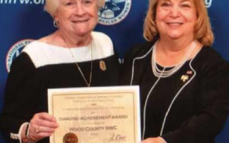 Ann Schockett, right, president of the National Federation of Republican Women, presents Beverly Hirzel with the Diamond Achievement Award for the Wood County Republican Women’s Club.