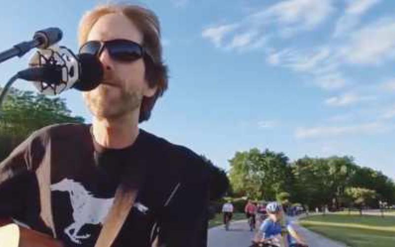 Local musician Slim performs at the Slow Roll.