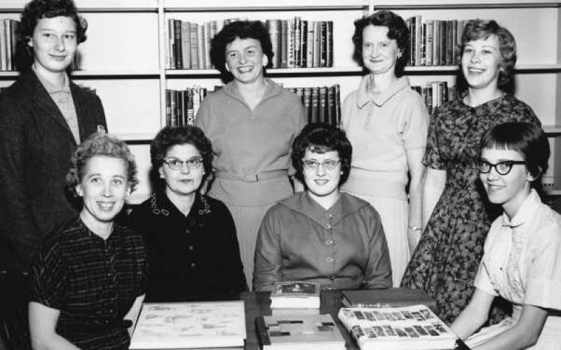 Way Public Library staff, approximately 1958, standing, from left: Judy Cable, Martha Hoffmann, Marguerite Heiderhorst and Patricia Roberts. Seated from left: Norma Anning, Phyllis Robison, Kay Cleary and Nancy English.