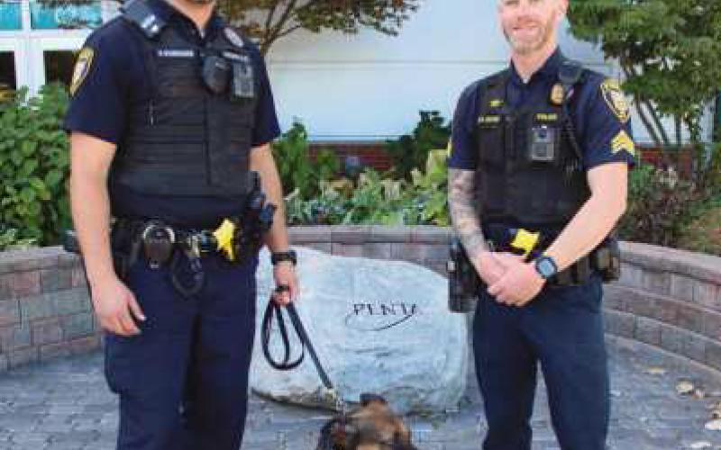Officer Kurt Schroeder with his K-9 Maty and Sergeant Dustin Glass of the Perrysburg Township Police Department serve as school resource officers at Penta Career Center.