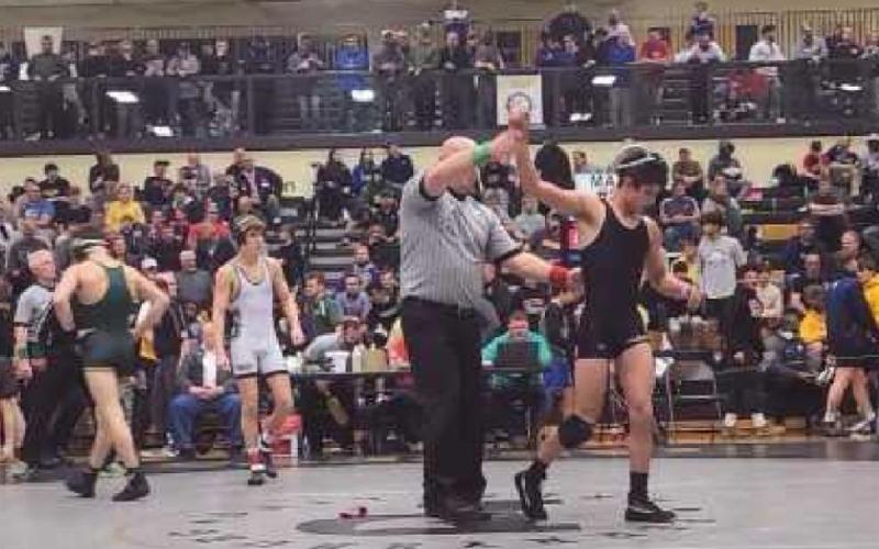 Above: Ryan Avalos gets a semifinal victory over Lakewood St. Edward.