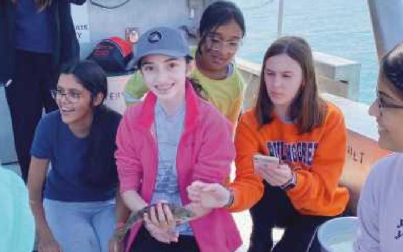 The seventh grade girls STEM club members went trawling for walleye and perch on the research vessel, Gibraltar III. From left are: Kaylanie Aguirre Burgos, Ria Khatri, Elena Fuentes, Maanya Parikh, Luella Eynon and Krisha Raichura.