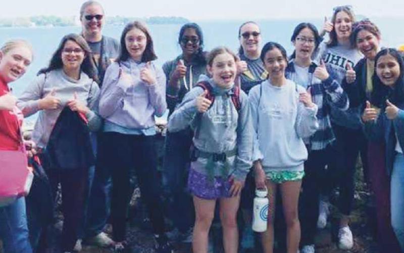 Members of the Perrysburg Junior High School eighth grade girls STEM club are shown preparing to collect water samples on Lake Erie. Pictured, from left, are: Aurora Marble, Helena Souza, Casey Hemmelgarn (PJHS teacher), Ella Hahn, Sashmika Kanumilli, Sophia Halm, Samantha Dutridge, Isabella Mati, Kate Wu, Macy Davidson, Jennifer Krueger (PJHS teacher) and Vesha Garg.