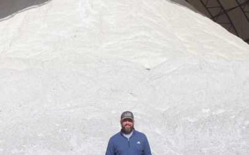 Mark Bressler, ODOT highway management, stands in front of the fully stocked rock salt storage shed.