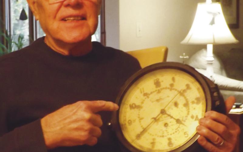 Mandell with a ship clock.
