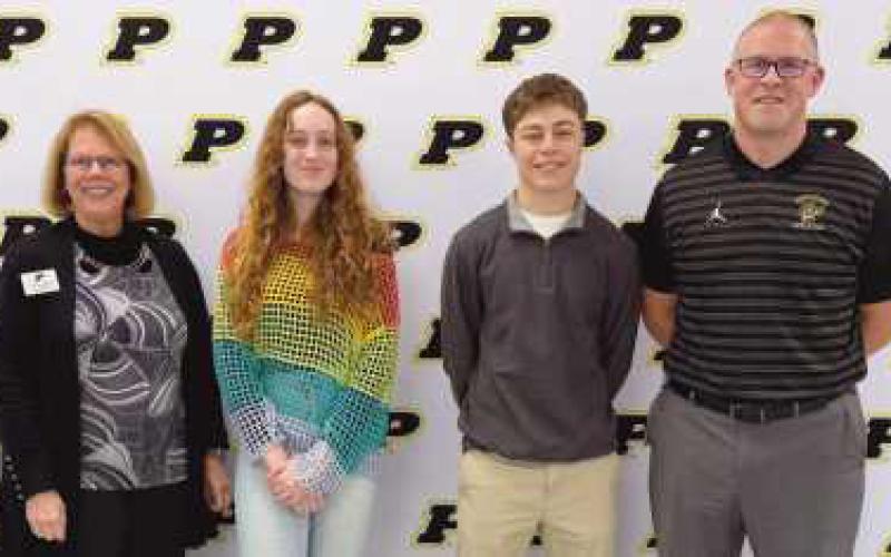 National Merit finalists Madison Fisher (center left), Karson Klapper (center right), Hannah Davies and William Hollenbeck (not pictured) were recognized.
