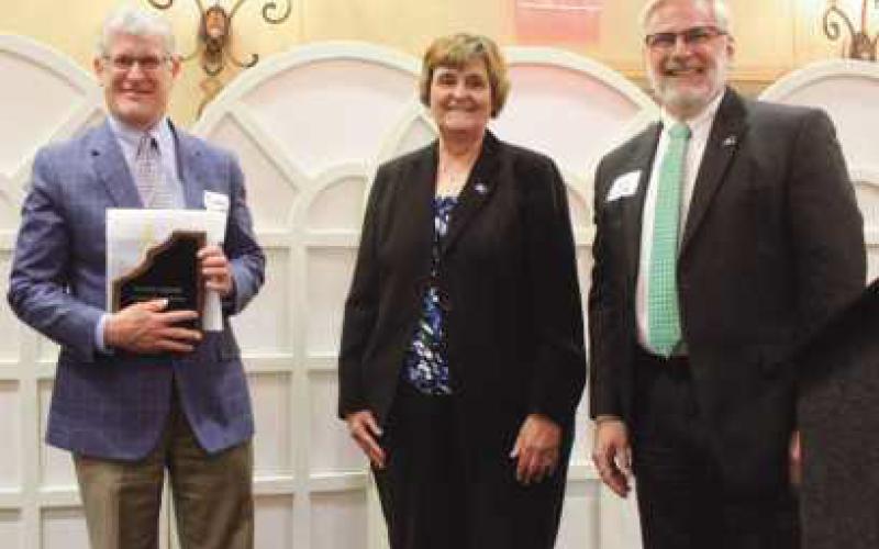 Above, from left, is Andrew Kalmar, retired Wood County administrator, and county commissioners Doris Herringshaw and Craig LaHote.