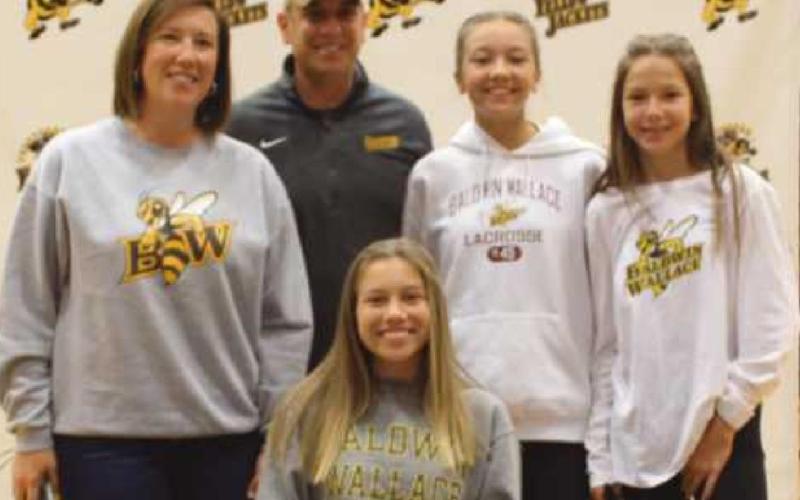 Lauren Getchey will play lacrosse for Baldwin Wallace University, where she plans to major in psychology. With her are her parents Kristin and John and her sisters Natalie and Leah.