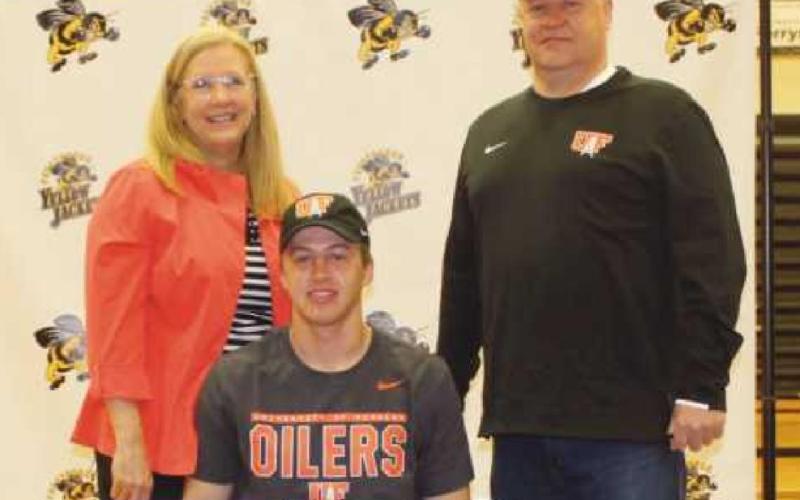 Christian Gulgin will play baseball for University of Findlay where he will study business. Pictured with him are his parents Chris and Doug.