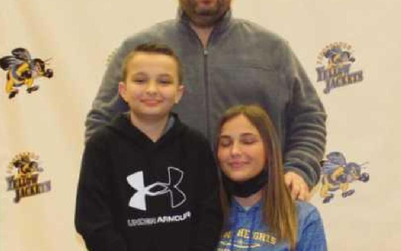 Haley Beier will run track for Siena Heights University where she will major in pre-med. Pictured with her are her father Andrew and brother Brock.