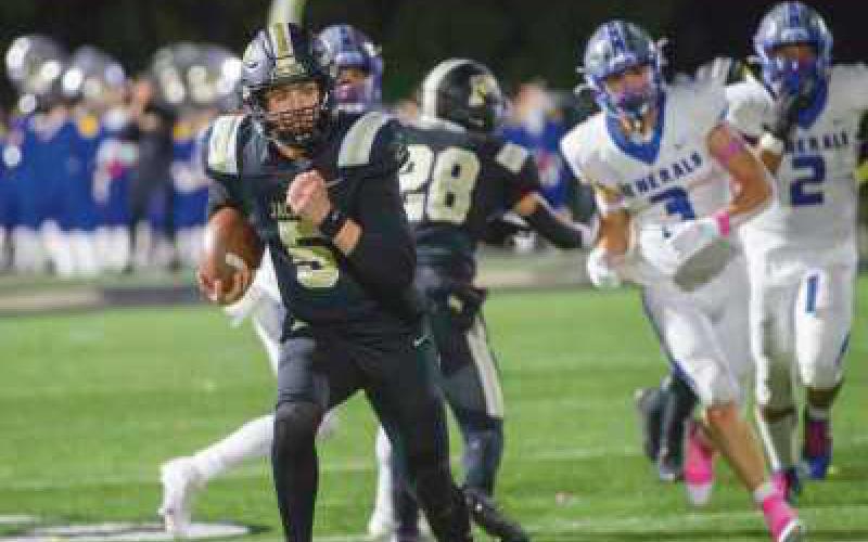 Quarterback Josh Takats finds running room as he breaks free of AW defenders.